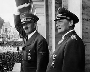 Adolf Hitler and Hermann Goering greet the crowds of relieved German citizens after the fall of France in 1940.