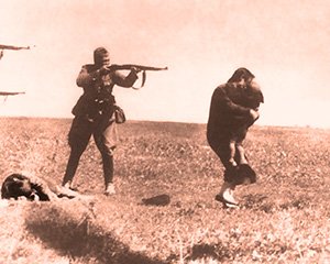 A defenceless young Jewish mother from Kiev vainly attempts to shield her young child from the bullets of the Nazi Einsatzgruppen executioners at the Jewish massacre at Ivangorod in Ukraine, 1942.