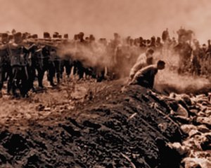 Nazi Einsatzgruppen executioners shooting innocent Jewish people during their season of brutal holocaust of Jewish populations across eastern Europe during World War Two.