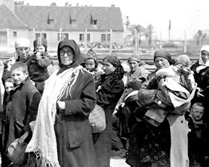 These Hungarian Jewish women and children are unwittingly walking straight to the Crematorium 3 gas chambers contained in the building visible in the background.&ensp;There they were to be gassed by the Nazis, immediately after they had disembalked from the railway cattle cars at the Auschwitz-Birkenau death camp in Poland in 1944.