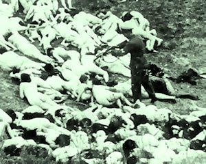 A Nazi Einsatzgruppen executioner finishes off a dying Jewish woman during a massacre of Jews in Ukraine in 1942.